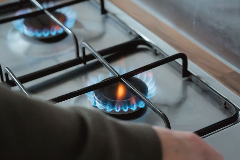 Gas engineer inspecting a gas hob in Norwich