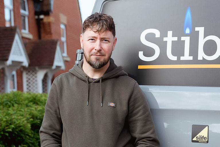 James from Stibbons Gas, Gas Safe boiler installer in Norwich, standing in front of his branded van