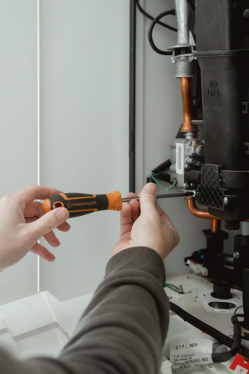 Gas engineer installing a boiler in Norwich